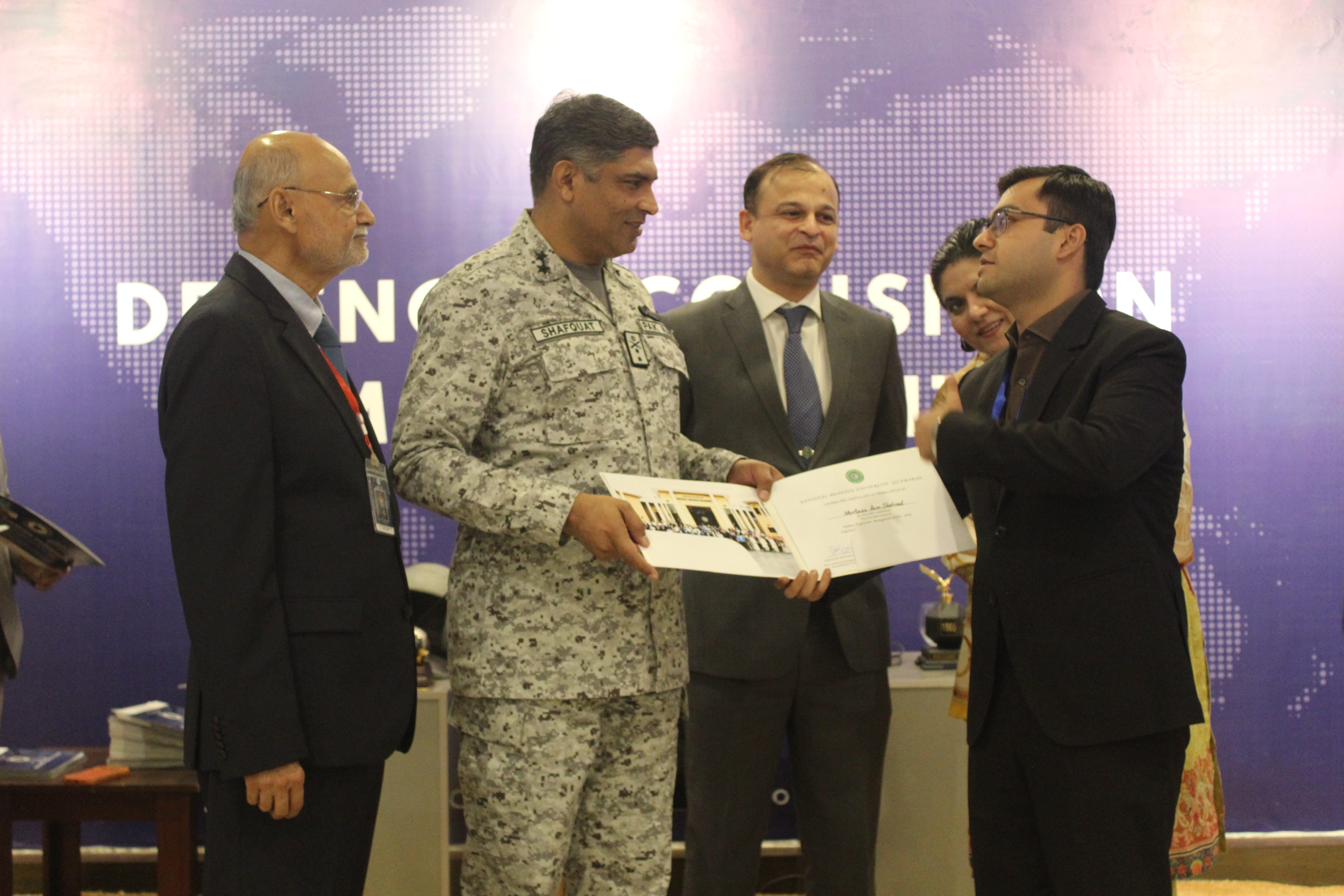 Certificate ceremony at ISSRA Hall during the Defence Acquisition Management 2026 short course